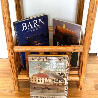 LOT 188: Handcrafted Log Style Side Table, Mountains / Cabin Wall Decor and Collection of Books