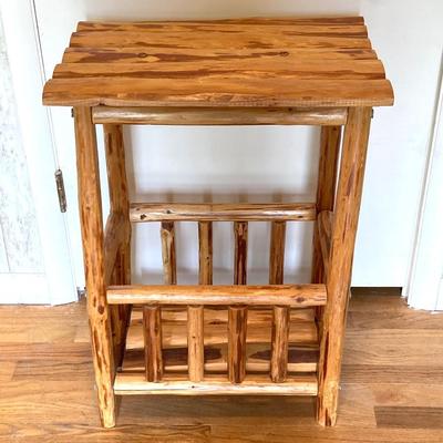 LOT 188: Handcrafted Log Style Side Table, Mountains / Cabin Wall Decor and Collection of Books