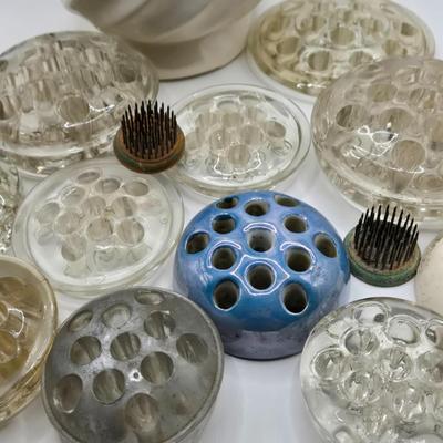 LOT 196: Multiple Glass and Metal Flower Frogs, 2 Planter Pots, and Watering Can with Seeds & Gloves