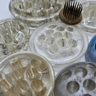 LOT 196: Multiple Glass and Metal Flower Frogs, 2 Planter Pots, and Watering Can with Seeds & Gloves