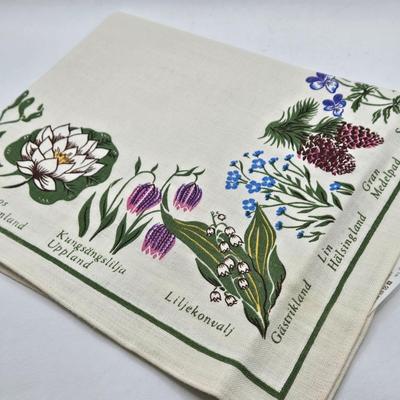 LOT 200: Cookbooks, Specialty Rolling Pins, Bundt Cake Pan, Handmade in Sweden Table Linen , Tile Trivet, Harkerware Serving Dish, and...