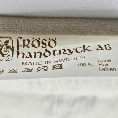 LOT 200: Cookbooks, Specialty Rolling Pins, Bundt Cake Pan, Handmade in Sweden Table Linen , Tile Trivet, Harkerware Serving Dish, and...