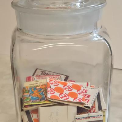 LOT Kitchen Lot with Apple Clock, Tupperware Jell-o Mold, Serving Plates, Cannister with Match Collection, and More