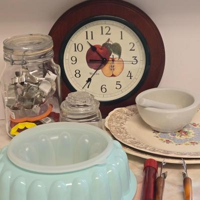 LOT Kitchen Lot with Apple Clock, Tupperware Jell-o Mold, Serving Plates, Cannister with Match Collection, and More