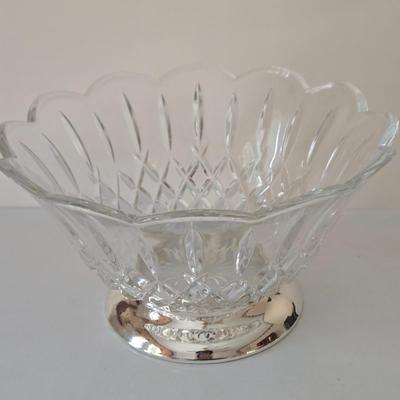 LOT 209: Formal Hostess Ware Including Encore Cake Stand, Silver-toned Candle Stick Holders, Footed Silver Plated Casserole Dish, and...