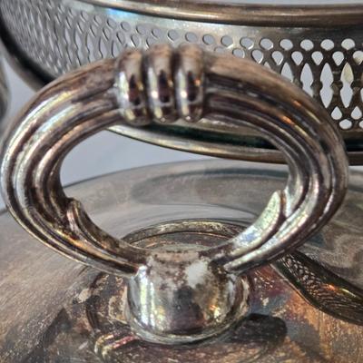 LOT 209: Formal Hostess Ware Including Encore Cake Stand, Silver-toned Candle Stick Holders, Footed Silver Plated Casserole Dish, and...