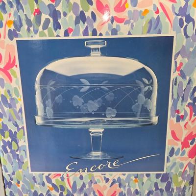 LOT 209: Formal Hostess Ware Including Encore Cake Stand, Silver-toned Candle Stick Holders, Footed Silver Plated Casserole Dish, and...