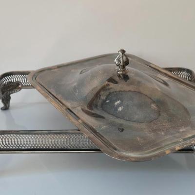 LOT 209: Formal Hostess Ware Including Encore Cake Stand, Silver-toned Candle Stick Holders, Footed Silver Plated Casserole Dish, and...