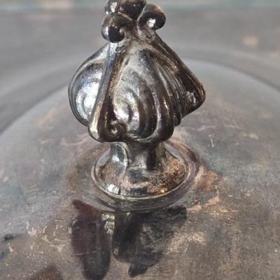 LOT 209: Formal Hostess Ware Including Encore Cake Stand, Silver-toned Candle Stick Holders, Footed Silver Plated Casserole Dish, and...