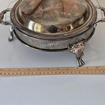 LOT 209: Formal Hostess Ware Including Encore Cake Stand, Silver-toned Candle Stick Holders, Footed Silver Plated Casserole Dish, and...