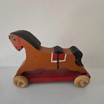 LOT 210: Edward Mobley Co. Arrow Rubber Corp. Horse Pony Squeak Toy, Fisher Price Molly Moo Cow, Handcrafted Wooden Toy Horse, and...