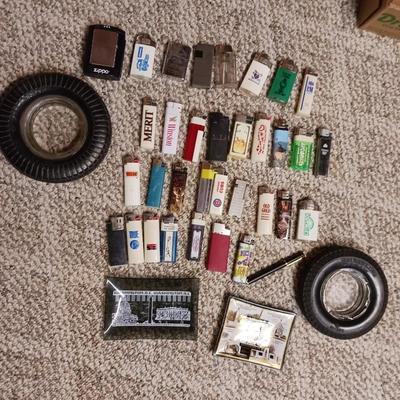 RUBBER TIRE AND GLASS ASHTRAYS PLUS MANY LIGHTERS