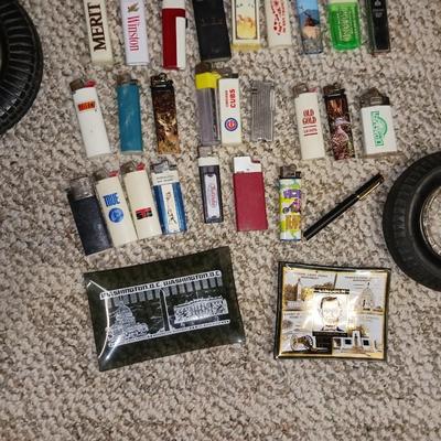 RUBBER TIRE AND GLASS ASHTRAYS PLUS MANY LIGHTERS