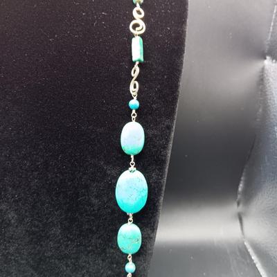 LONG GENUINE TURQUOISE NECKLACE WITH STERLING SILVER ACCENTS MARKED KL