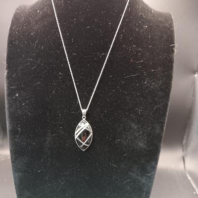 BLACK STONE WRAPPED IN STERLING SILVER W/A STERLING CHAIN