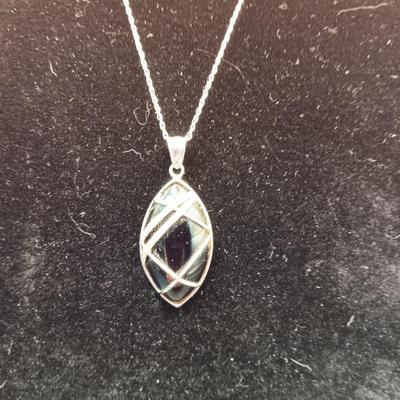 BLACK STONE WRAPPED IN STERLING SILVER W/A STERLING CHAIN