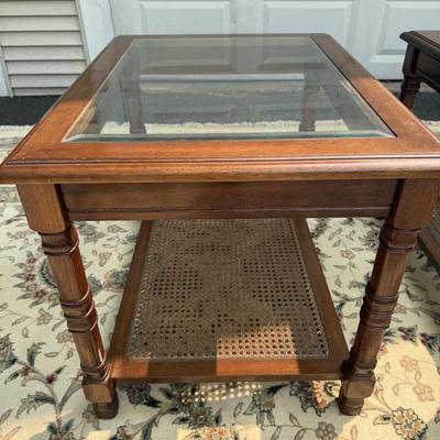 Two beautiful glass top caned tables