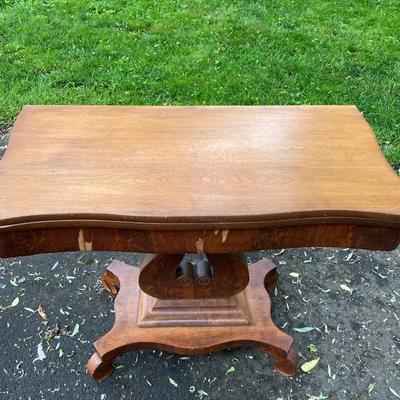 Folding table with music scroll motif base