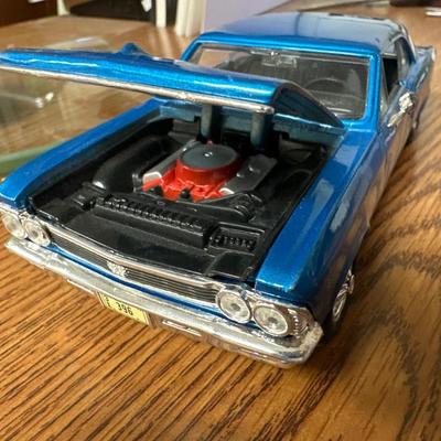 Sale Photo Thumbnail #23: Both on display at the ReStore 
Blue car is 1/24 scale. Back wheel pops off. 
1958 Danbury mint