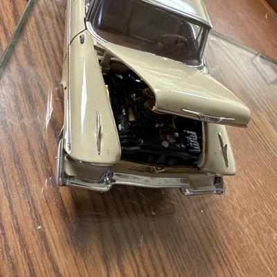 Sale Photo Thumbnail #24: Both on display at the ReStore 
Blue car is 1/24 scale. Back wheel pops off. 
1958 Danbury mint