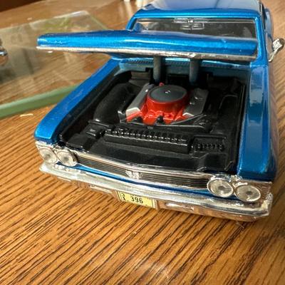 Sale Photo Thumbnail #25: Both on display at the ReStore 
Blue car is 1/24 scale. Back wheel pops off. 
1958 Danbury mint