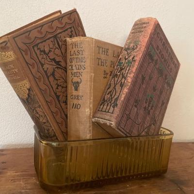 Amber glass ice box with vintage books