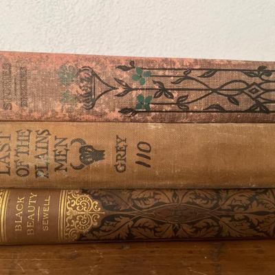 Amber glass ice box with vintage books