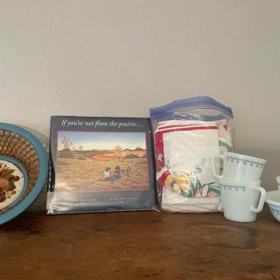 Prairie book with Pyrex mugs/bowls, blue bowl and fabrics napkins