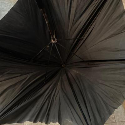 Antique umbrella with carved handle