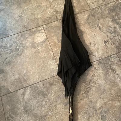 Antique umbrella with carved handle