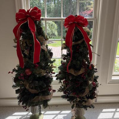 2 pretty Christmas trees with bows
