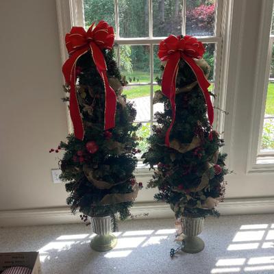 2 pretty Christmas trees with bows