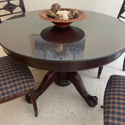 Solid wood round claw foot table and four chairs (includes glass top)