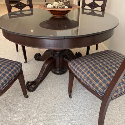 Solid wood round claw foot table and four chairs (includes glass top)