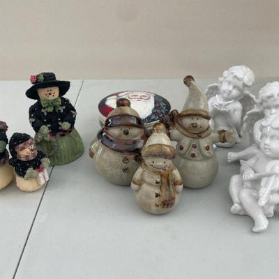 Three separate sets of Christmas figurines