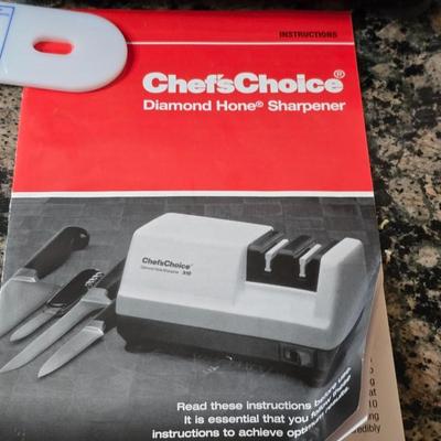 Knife & Sharpener Lot – Chef’s Choice Model 310 electric knife sharpener with some knives and a cutting board