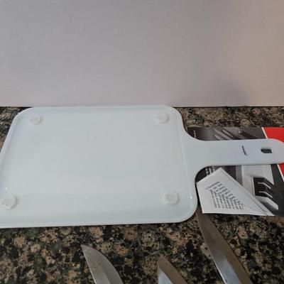 Knife & Sharpener Lot – Chef’s Choice Model 310 electric knife sharpener with some knives and a cutting board