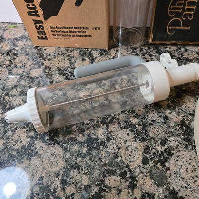 Assortment of The Pampered Chef kitchen items and Large Round Stone