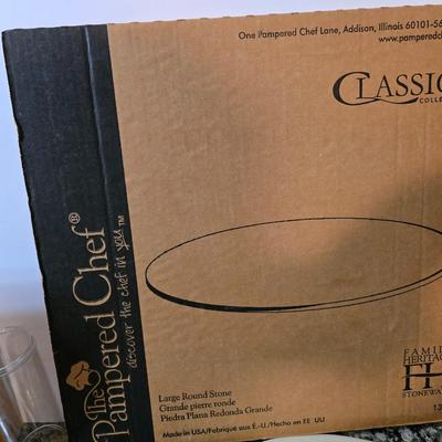 Assortment of The Pampered Chef kitchen items and Large Round Stone