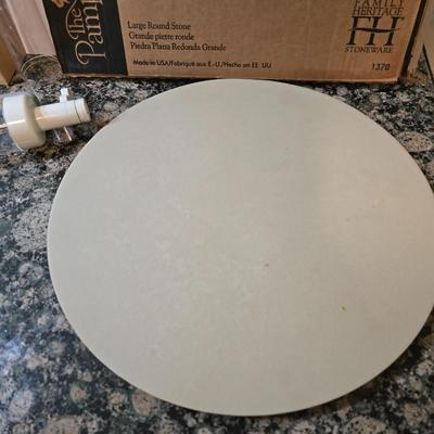 Assortment of The Pampered Chef kitchen items and Large Round Stone