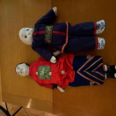 Pair of Chinese dolls with porcelain heads and feet
