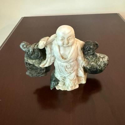 Chinese soapstone male carrying sacks