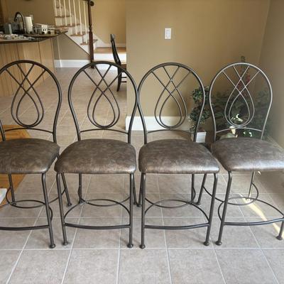Four leather and metal counter height stools
