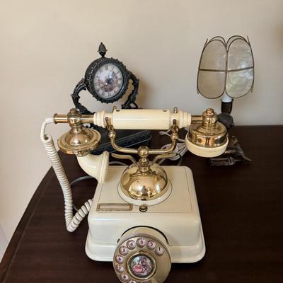 Lot of fun vintage looking decor with telephone, clock and lamp