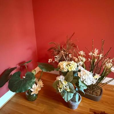 Four white silk floral arrangements