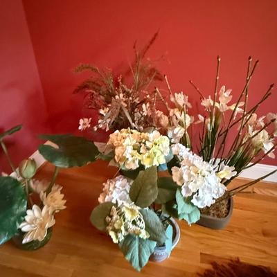Four white silk floral arrangements