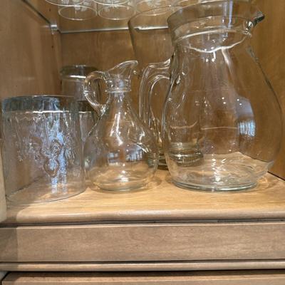 Two glass pitchers and low ball glasses