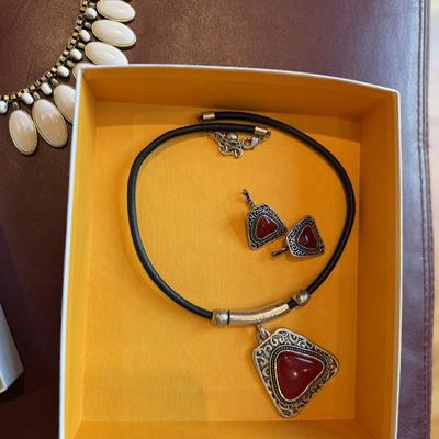 Four pretty necklaces and matching earrings