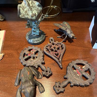 Antique metal trivets and animal figures