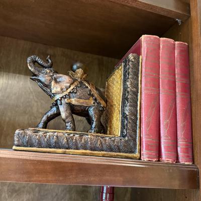 Pair of elephant book ends with books